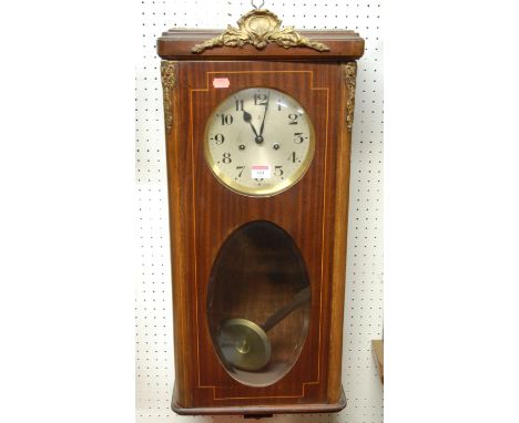 An early 20th century mahogany, boxwood strung and gilt metal mounted wall clock, the silvered dial with Arabic numerals havi