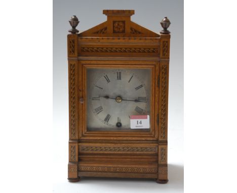 A late 19th century German walnut cased and Tunbridge decorated mantel clock, of architectural form, having silvered dial wit