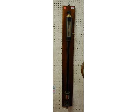 A late 19th century marine barometer having a sliding silvered scale on mahogany back board by Baird &amp; Tatlock of Glasgow