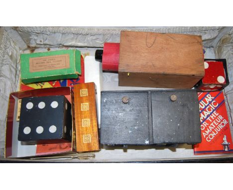 A leather case containing a quantity of bygone magic tricks, to include The Unique Billiard Ball Illusion
