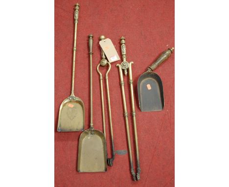 A small collection of Victorian and later turned brass fire tools