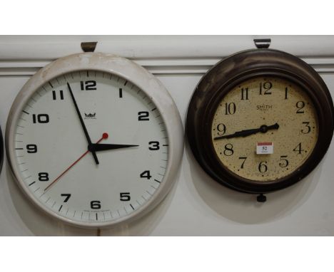A circa 1930 Smiths bakelite cased eight day wall clock, the dial with Arabic numerals and signed Smiths 8 Day Made in Englan