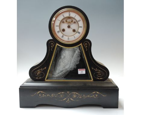 A large late 19th century black slate drum-head mantel clock, having enamelled chapter ring with Roman numerals and visible e