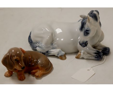 A Royal Copenhagen porcelain model of a foal in recumbent pose printed mark verso numbered 5690, height 11cm, together with o