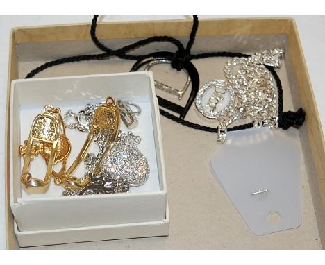A Vivienne Westwood enamelled and paste set ladies bracelet, boxed, together with a Christian Dior chain link necklace etc