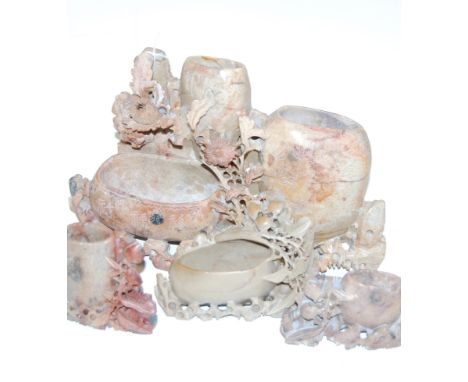 A large Chinese soapstone boulder carved with various flowers etched with various Chinese symbols and flowers, height 18cm, t