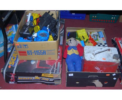 Two boxes containing a quantity of Scalextric racing items, to include Minis, racing pit boxed kit, empty bygone fuel tanker,