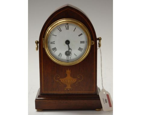 An Edwardian mahogany and satinwood inlaid cased lancet shaped mantel clock, having enamelled dial with Roman numerals and th