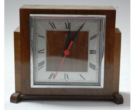 A 1950s oak cased mantel clock, having silvered Arabic numerals; together with two other similar (3)