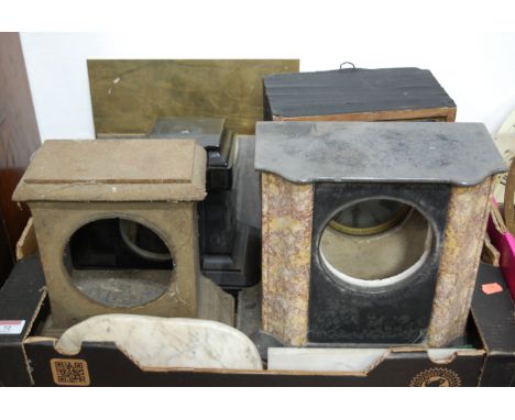 A box of miscellaneous clock cases and parts, to include black slate and rouge marble examples