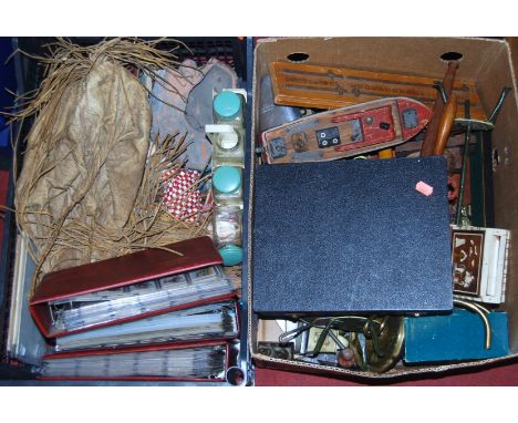 Two boxes containing a quantity of mixed collectables, to include tea cards, brassware, wooden model boat, bygone shop till e