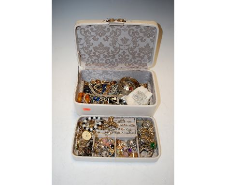 A cream leather clad jewellery box and contents to include paste set dress rings, gold plated bangle, ladies stud earrings, e