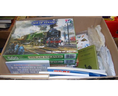 A box containing a quantity of stamps, puzzles, and model collecting books including locomotive examples