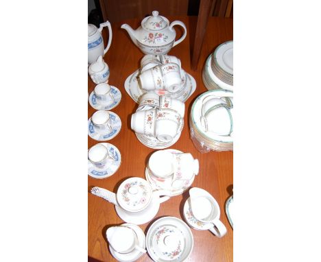 A Royal Doulton eight place setting tea service in the Kingswood pattern, together with a Royal Albert 'tea-for-two' service 