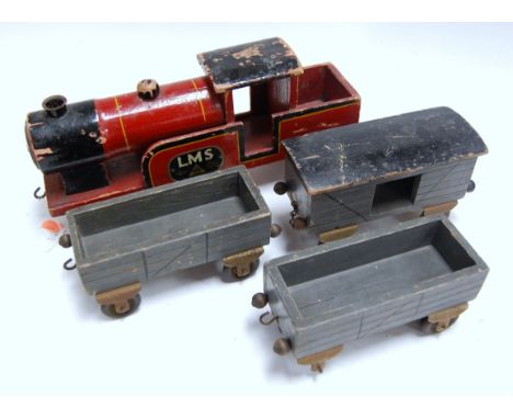 An early 20th century Lines Brothers wooden carpet train and three wagons (4)