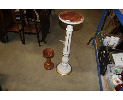 A gilt and cream painted jardinière stand and a turned wooden pricket stick