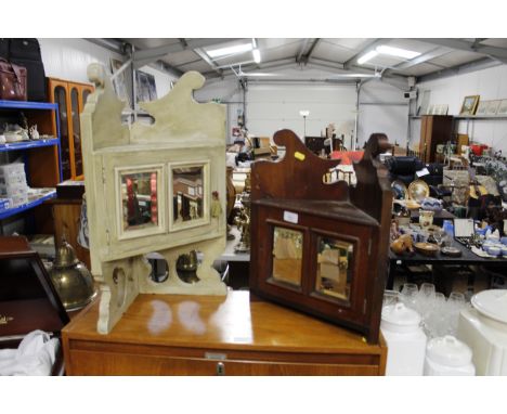 Two mirrored corner trinket cabinets 