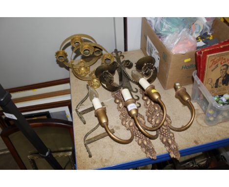 A pair of gilt acorn and berry decorated twin branch wall lights, another pair of wall lights, a single twin branch wall ligh