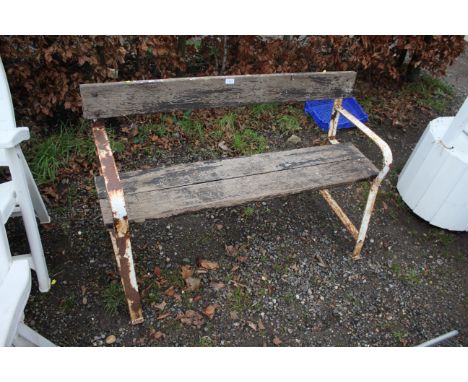 A wooden and metal framed garden two seater bench