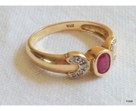 A ladies 9ct gold ruby and diamond ring. size P