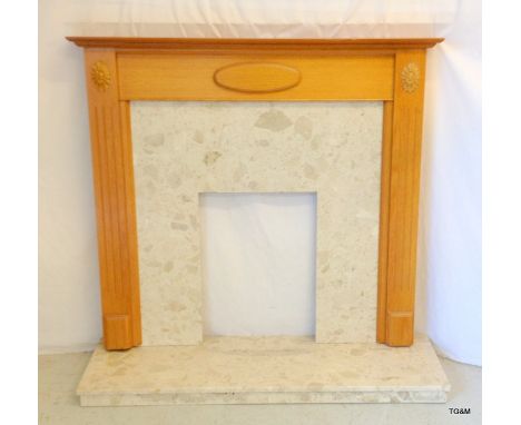 A light Oak framed marble fire surround and base. 115 x 122