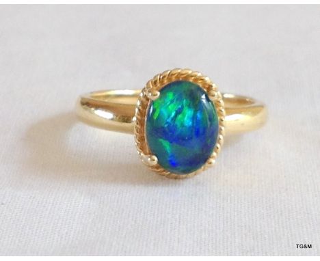 A ladies 9ct gold opal ring size N