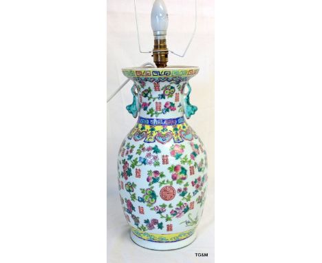 A Chinese porcelain vase with enamelled decoration - marks to the base 37cm high converted to a lamp