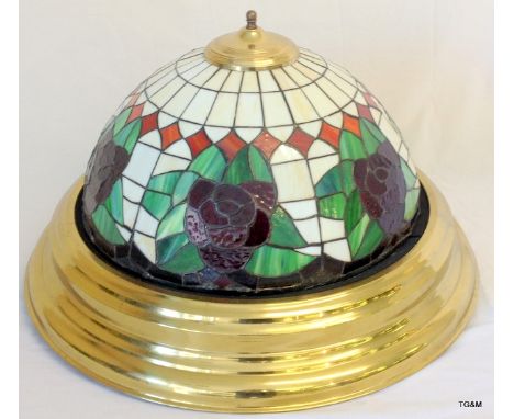 A large Tiffany style dome ceiling fitted light