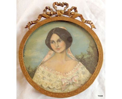 Early 20th portrait miniature of young Lady. Circular ribbon top brass frame  13cm high