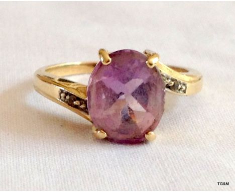 A ladies 9ct gold Amethyst and diamond ring size Q 
