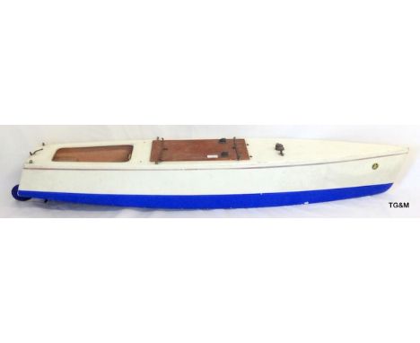 A vintage c1940's pond speed boat with engine makers mark K