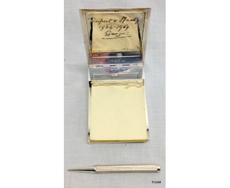 An Asprey & Co. Engine-turned silver desk note book with matching propelling pencil