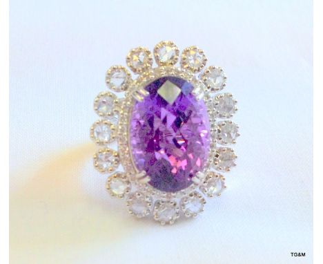 An 18ct White gold Amethyst and Diamond Ring. Central Stone 15ct and 1ct of Diamonds