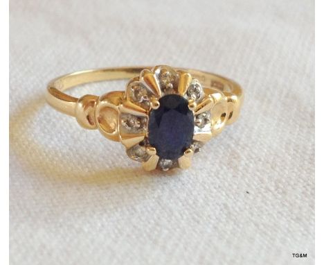 A ladies 9ct gold sapphire and diamond ring. size P