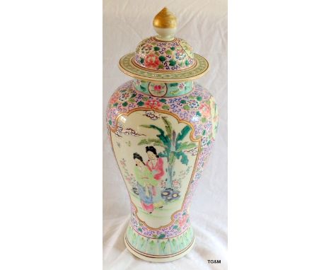 Chinese famille rose jar and cover. Pink ground with panels of figures and birds. 36cm high