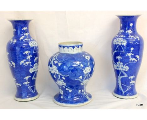 A pair of Oriental Blue & White Slender Ovoid Vases with Flared Rims and a Ginger Jar