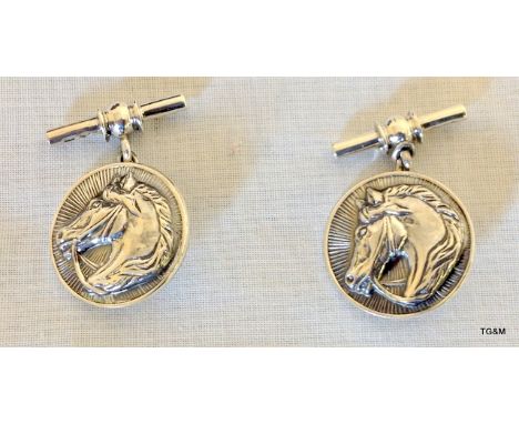 A Pair of Silver Cufflinks depicting Horses