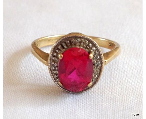 A 9ct gold ruby and diamond ring size K