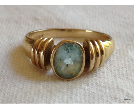 A ladies 9ct gold and aquamarine ring. size P