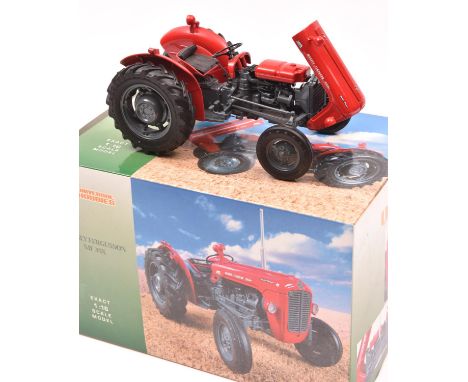 A Universal Hobbies 1:16 scale model of a Massey Fergusson MF35X tractor (UH2692). A very well detailed model in red. Boxed. 