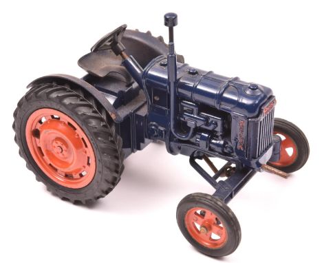 Chad Valley clockwork Fordson Major tractor. In dark blue with orange wheels and black rubber tyres. GC. Clockwork action in 