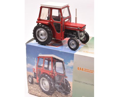 A Universal Hobbies 1:16 scale model of a Massey Fergusson 135 tractor (UH2697U). A very well detailed model in red. Boxed, m