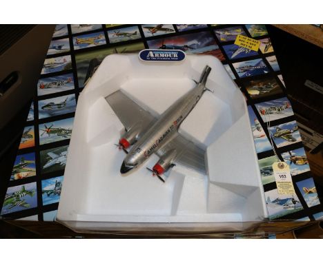 A large 1:48 scale Armour Collection model of an American Douglas C-47 Troop Carrier. In silver U.S. Air Force 'Camel Caravan