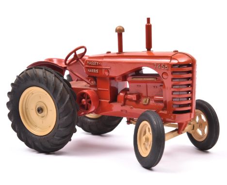 A large scale Moko Lesney Massey Harris Tractor. In red with cream wheels and black rubber tyres. Complete with steering in w