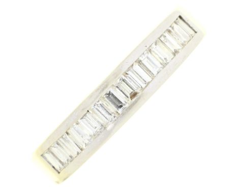 A diamond ring, with nine baguette cut diamonds, in white gold marked 750, 5g, size L½ Good condition