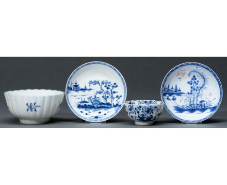 A Worcester blue and white tea bowl, slop basin and two saucers, c1758-85&nbsp; painted with the Hollow Rock, Lily, Gillyflow