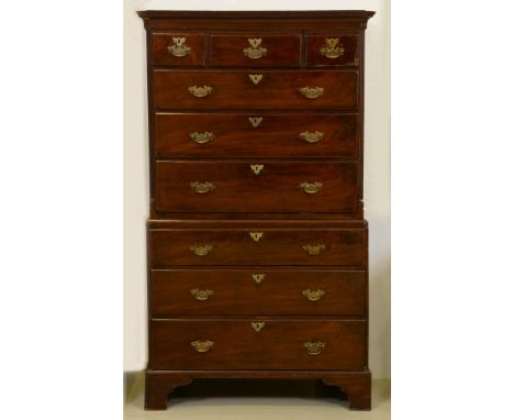 A George III mahogany chest on chest,&nbsp; the upper part with cavetto cornice and fitted with moulded drawers flanked by fl