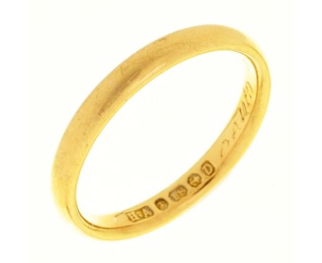 An 18ct gold wedding ring, Birmingham 1953, 2.9g, size K½ Slight wear and engraved inscription