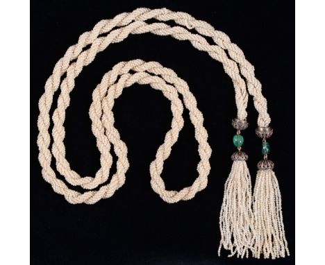 A Belle Epoque ruby, diamond, emerald and seed pearl sautoir, of twisted rope design, the twin tassels each with emerald bead