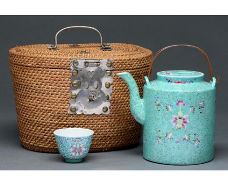 A Chinese turquoise ground famille rose kettle, cover and&nbsp; tea bowl, first half 20th c,&nbsp; enamelled with lotus, copp
